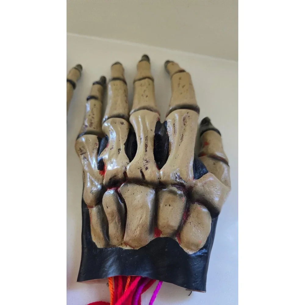 Skeleton Hand Prop Pair Realistic Bone Finish with Yarn Fringe Halloween Decor